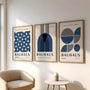 navy and cream bauhaus poster set of 3 arranged in refined modern gallery wall