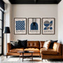 navy and cream geometric bauhaus poster set in contemporary office workspace