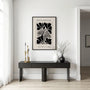 Minimalist botanical floral poster in beige tones styled in calm bedroom interior