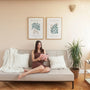 Set of 2 botanical form posters styled in bright living room with natural decor