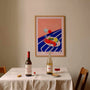 colorful seafood and cocktail wall art in dining area